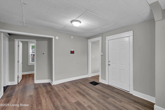 209 W Kenton St, Louisville, KY 40214 - entrance foyer featuring a drop ceiling, wood finished floors, and baseboards