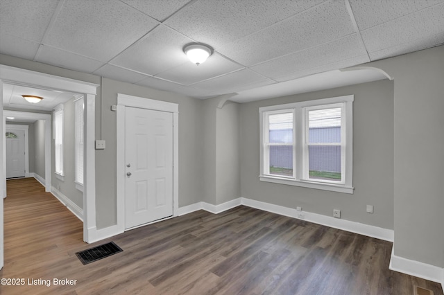 209 W Kenton St, Louisville, KY 40214 - foyer entrance featuring a paneled ceiling, dark wood-style flooring, baseboards, and arched walkways