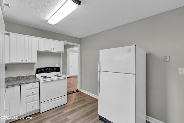 209 W Kenton St, Louisville, KY 40214 - kitchen with white appliances, white cabinets, light wood-style flooring, baseboards, and a textured ceiling