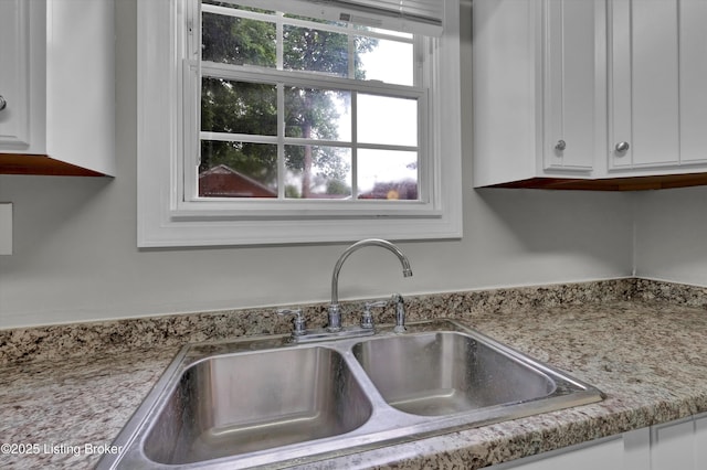 209 W Kenton St, Louisville, KY 40214 - kitchen view of a sink and white cabinetry