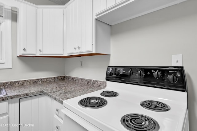 209 W Kenton St, Louisville, KY 40214 - kitchen featuring electric stove, white cabinets, and light countertops