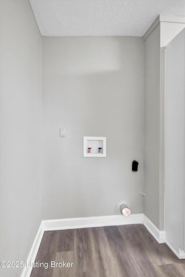 209 W Kenton St, Louisville, KY 40214 - laundry area featuring hookup for a washing machine, wood finished floors, baseboards, and a textured ceiling