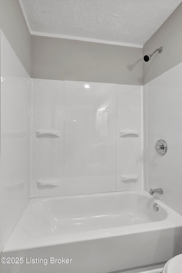 209 W Kenton St, Louisville, KY 40214 - full bathroom with a textured ceiling,  shower combination, and toilet