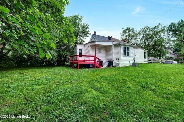 209 W Kenton St, Louisville, KY 40214 - rear view of house featuring a chimney, a yard, a deck, and cooling unit