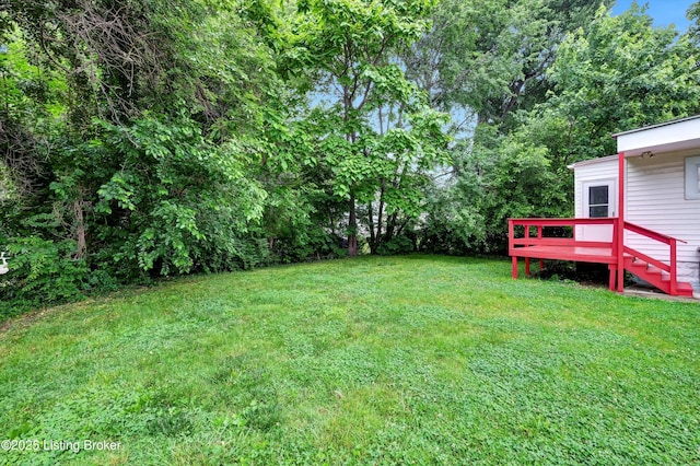 209 W Kenton St, Louisville, KY 40214 - view of grassy yard with a wooden deck