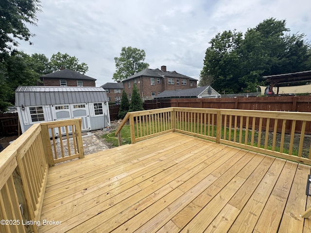 1236 Carrico Ave, Louisville, KY 40215 - wooden deck with a fenced backyard and an outbuilding