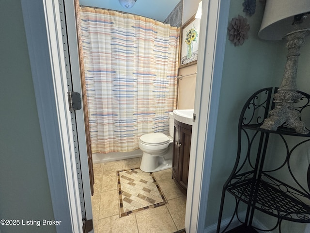 1236 Carrico Ave, Louisville, KY 40215 - bathroom with tile patterned flooring, toilet, and vanity