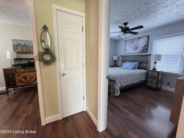 1236 Carrico Ave, Louisville, KY 40215 - bedroom featuring a textured ceiling, dark wood-style floors, and baseboards