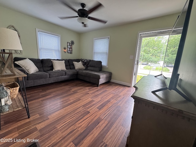 1236 Carrico Ave, Louisville, KY 40215 - living area featuring dark wood-style flooring, ceiling fan, and baseboards