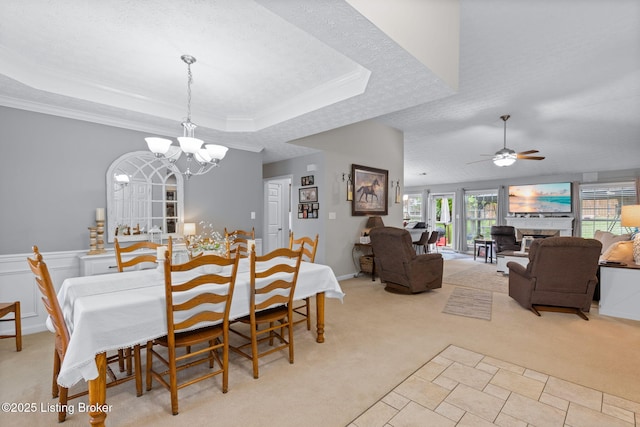 8506 Hunting Stock Pl, Louisville, KY 40291 - dining space featuring a tray ceiling, a chandelier, light carpet, ceiling fan, and ornamental molding