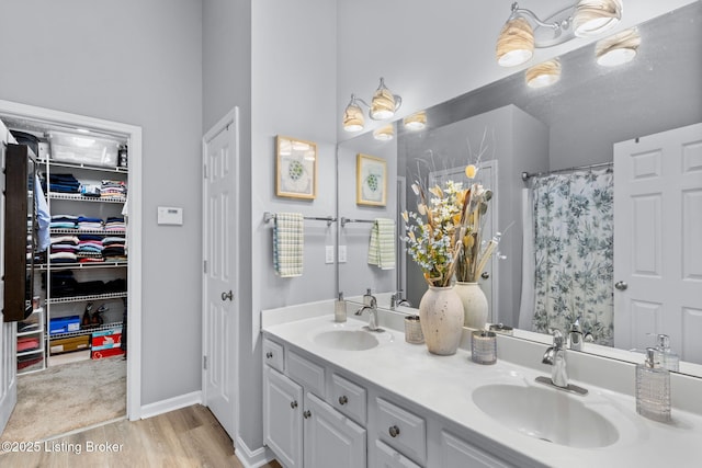 8506 Hunting Stock Pl, Louisville, KY 40291 - bathroom with double vanity, wood finished floors, baseboards, and a shower with shower curtain