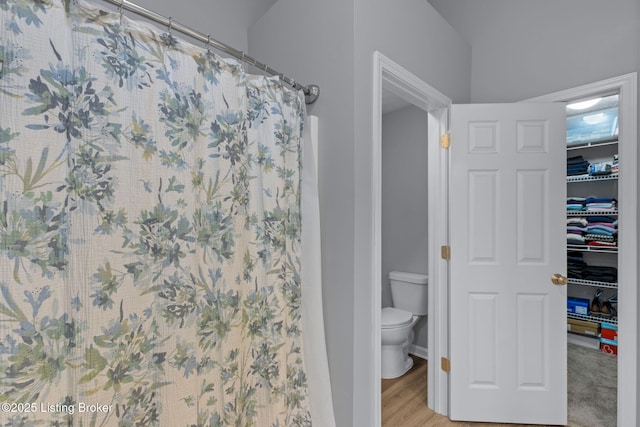 8506 Hunting Stock Pl, Louisville, KY 40291 - bathroom featuring toilet, a shower with shower curtain, a walk in closet, and wood finished floors