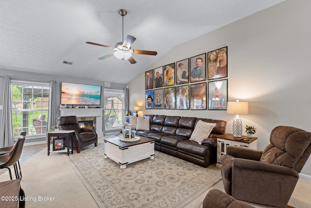 8506 Hunting Stock Pl, Louisville, KY 40291 - living room featuring carpet, a ceiling fan, lofted ceiling, and a tile fireplace