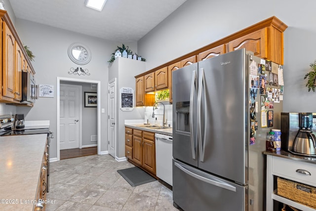 8506 Hunting Stock Pl, Louisville, KY 40291 - kitchen with appliances with stainless steel finishes, a sink, and brown cabinets
