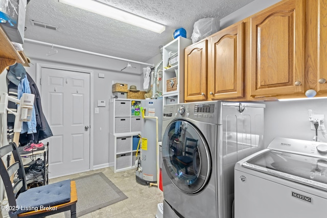 8506 Hunting Stock Pl, Louisville, KY 40291 - laundry room with washing machine and clothes dryer, cabinet space, gas water heater, and a textured ceiling