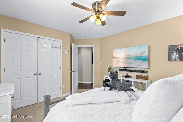 8506 Hunting Stock Pl, Louisville, KY 40291 - bedroom with a closet, ceiling fan, carpet flooring, baseboards, and a textured ceiling