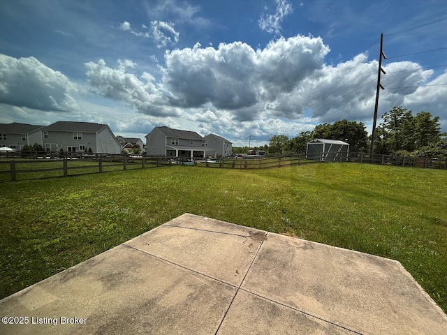 373 University Dr, Walton, KY 41094 - fenced backyard featuring a patio and an outbuilding