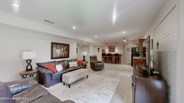 150 E Laurel River Drive Rd, Shepherdsville, KY 40165 - living room featuring light wood-style floors, recessed lighting, and bar area