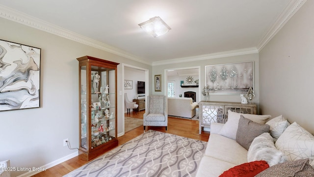150 E Laurel River Drive Rd, Shepherdsville, KY 40165 - living area featuring ornamental molding, wood finished floors, baseboards, and a fireplace