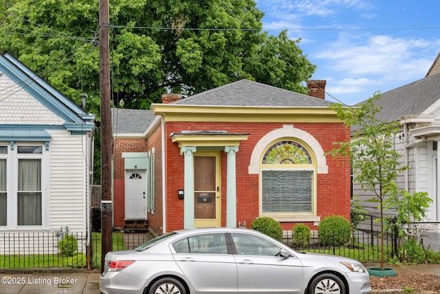 965 S Shelby St, Louisville, KY 40203 - view of front of property featuring a chimney, brick siding, and a shingled roof