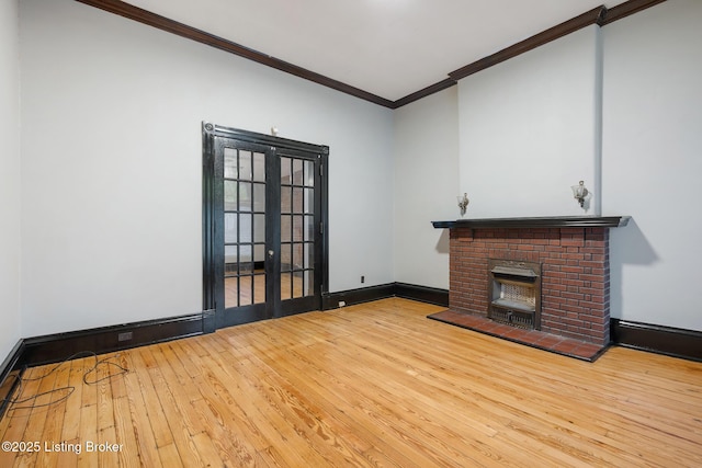 965 S Shelby St, Louisville, KY 40203 - unfurnished living room featuring french doors, ornamental molding, hardwood / wood-style flooring, a fireplace, and baseboards