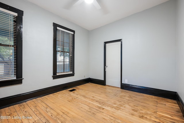965 S Shelby St, Louisville, KY 40203 - unfurnished room with ceiling fan, wood-type flooring, plenty of natural light, and baseboards