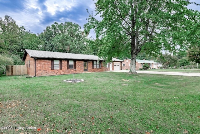 800 Lincoln Dr, Elizabethtown, KY 42701 - ranch-style house with brick siding, an attached garage, and concrete driveway