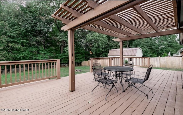800 Lincoln Dr, Elizabethtown, KY 42701 - wooden deck with outdoor dining space, a pergola, and view of scattered trees