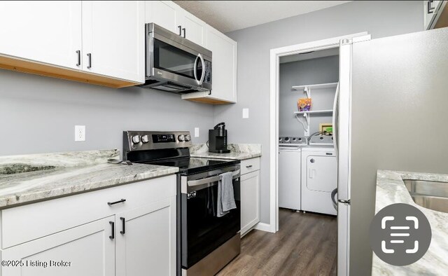 800 Lincoln Dr, Elizabethtown, KY 42701 - kitchen featuring stainless steel appliances, washing machine and dryer, wood finished floors, white cabinets, and light stone counters