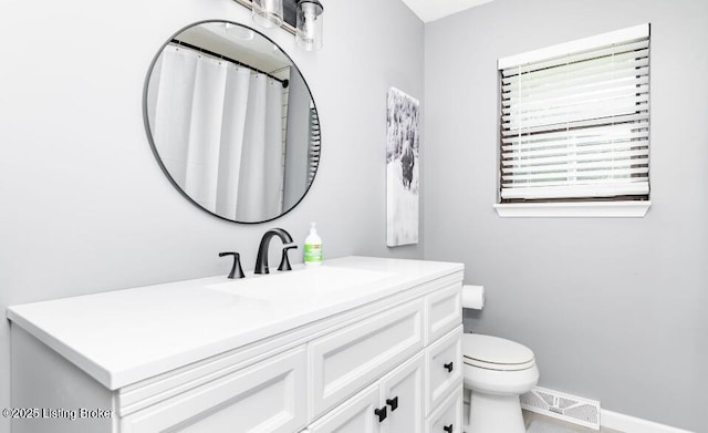 800 Lincoln Dr, Elizabethtown, KY 42701 - full bathroom with vanity, baseboards, and toilet