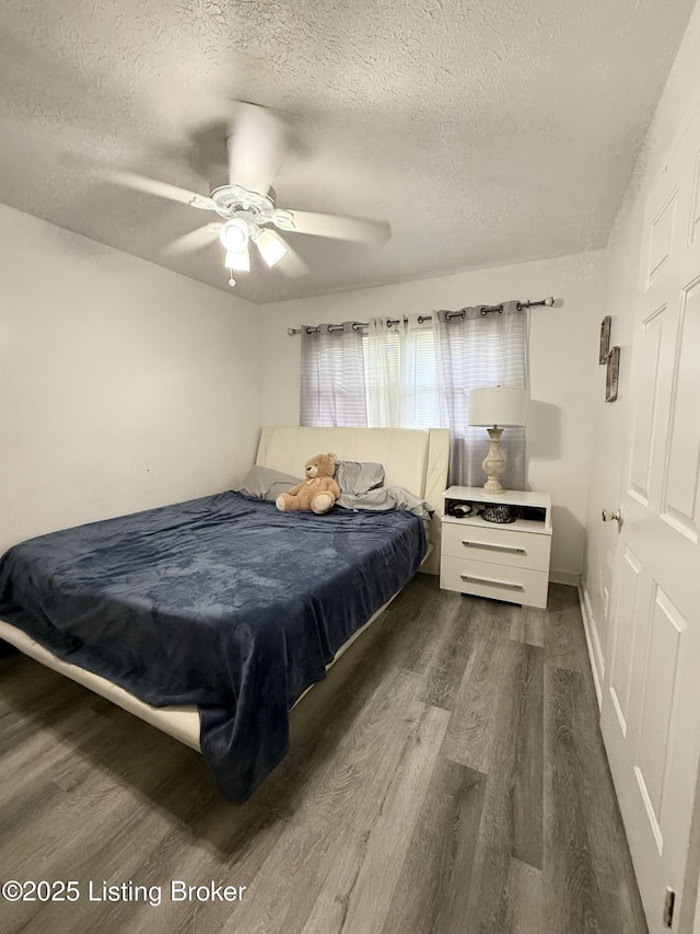 6205 Forsythia Ln, Louisville, KY 40229 - bedroom featuring a textured ceiling, dark wood finished floors, and ceiling fan