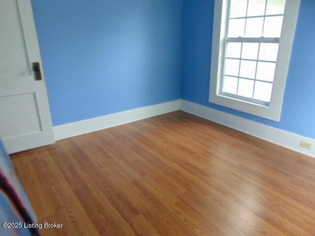 27 Alexander Ave, Bedford, KY 40006 - empty room with wood finished floors and baseboards
