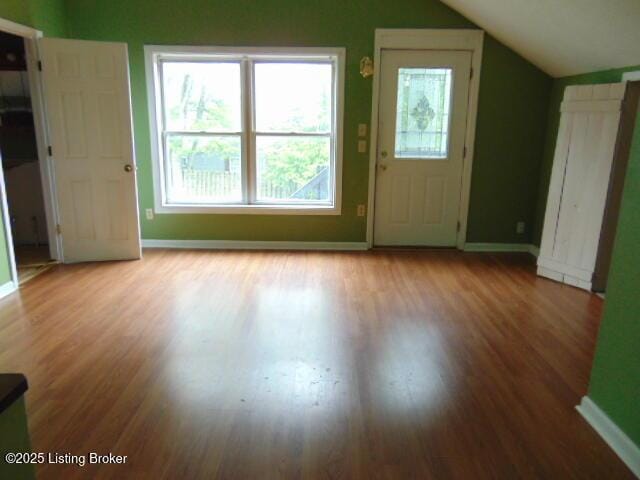 27 Alexander Ave, Bedford, KY 40006 - foyer with vaulted ceiling, wood finished floors, and baseboards