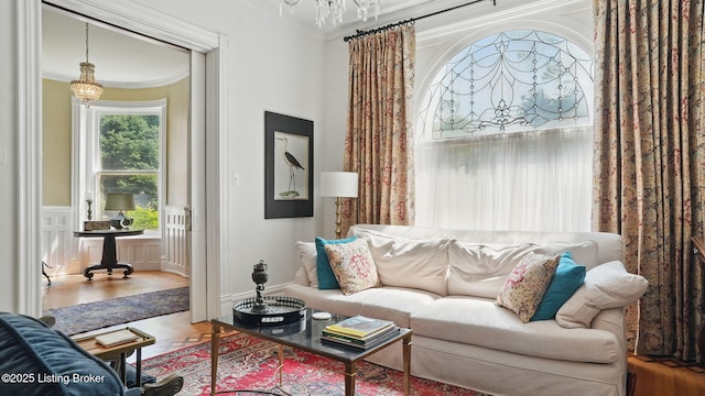 1212 S 2nd St, Louisville, KY 40203 - living area featuring a chandelier, crown molding, and wood finished floors