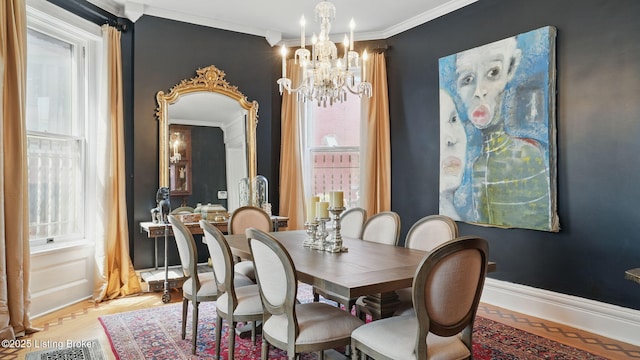 1212 S 2nd St, Louisville, KY 40203 - dining room with a chandelier, ornamental molding, and light wood finished floors