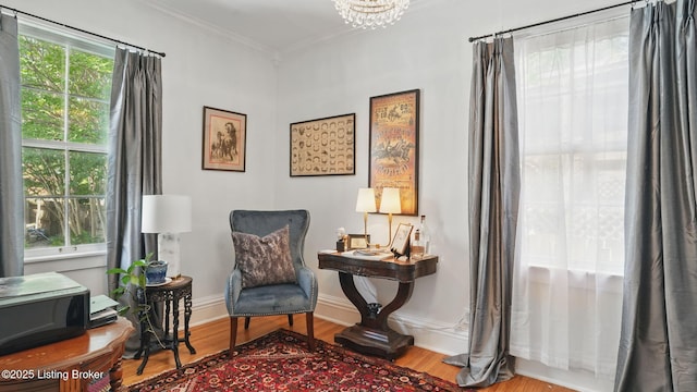 1212 S 2nd St, Louisville, KY 40203 - living area with crown molding, wood finished floors, and a chandelier