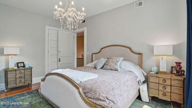 1212 S 2nd St, Louisville, KY 40203 - bedroom featuring a chandelier and wood finished floors