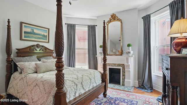 1212 S 2nd St, Louisville, KY 40203 - bedroom with wood finished floors and a fireplace