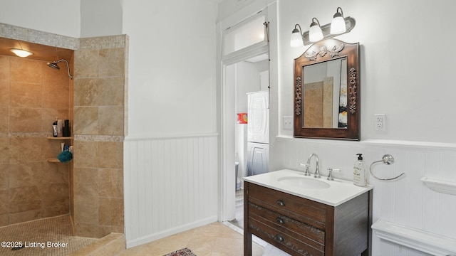 1212 S 2nd St, Louisville, KY 40203 - bathroom with wainscoting, vanity, and a tile shower