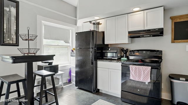 1212 S 2nd St, Louisville, KY 40203 - kitchen with black appliances, under cabinet range hood, white cabinets, and dark countertops