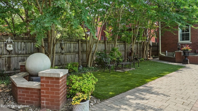 1212 S 2nd St, Louisville, KY 40203 - fenced backyard featuring a patio