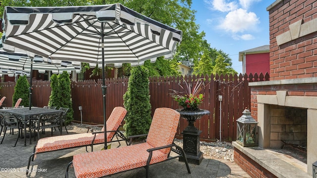 1212 S 2nd St, Louisville, KY 40203 - view of patio / terrace with an outdoor brick fireplace and outdoor dining area