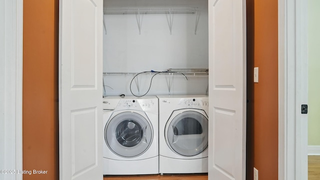 1212 S 2nd St, Louisville, KY 40203 - laundry room with washer and clothes dryer and wood finished floors