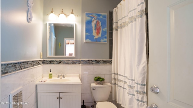 1212 S 2nd St, Louisville, KY 40203 - full bath with tile walls, vanity, curtained shower, a wainscoted wall, and heating unit