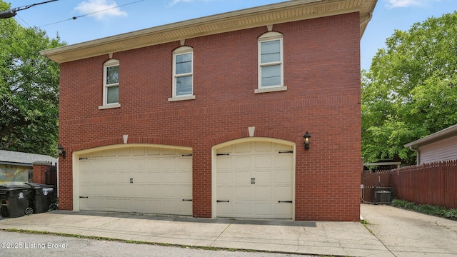 1212 S 2nd St, Louisville, KY 40203 - view of front of house featuring a garage and brick siding