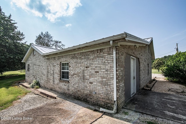 201 Wildflower Ln, Big Springs, KY 40175 - view of side of property featuring brick siding and metal roof