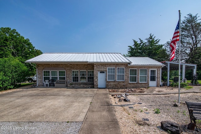 201 Wildflower Ln, Big Springs, KY 40175 - view of front of home featuring brick siding and metal roof