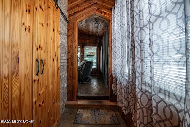 201 Wildflower Ln, Big Springs, KY 40175 - hall featuring vaulted ceiling, wood walls, and arched walkways