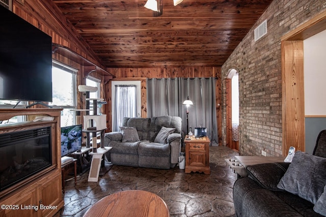 201 Wildflower Ln, Big Springs, KY 40175 - living area with stone floors, wood ceiling, lofted ceiling, arched walkways, and wooden walls