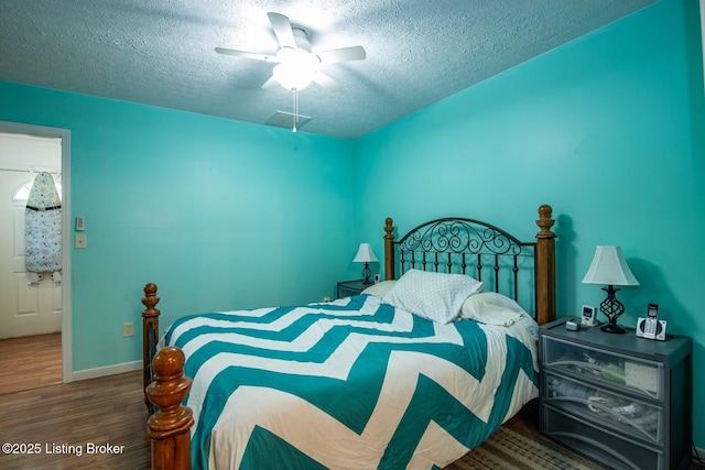 201 Wildflower Ln, Big Springs, KY 40175 - bedroom featuring a textured ceiling, wood finished floors, baseboards, and ceiling fan